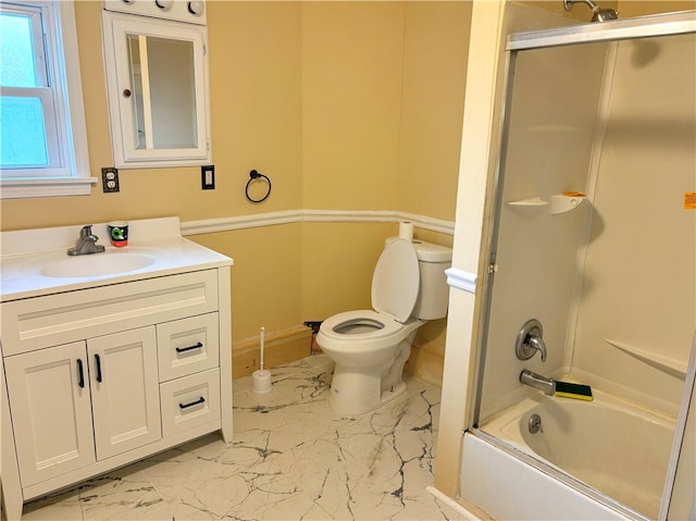 full bathroom featuring vanity, toilet, and enclosed tub / shower combo