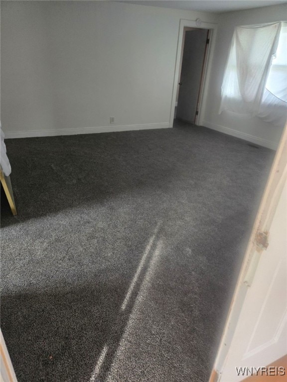 75 Schaefer Rd, West Seneca, NY 14218 - spare room with baseboards and dark colored carpet