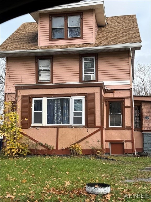 view of home's exterior with a lawn