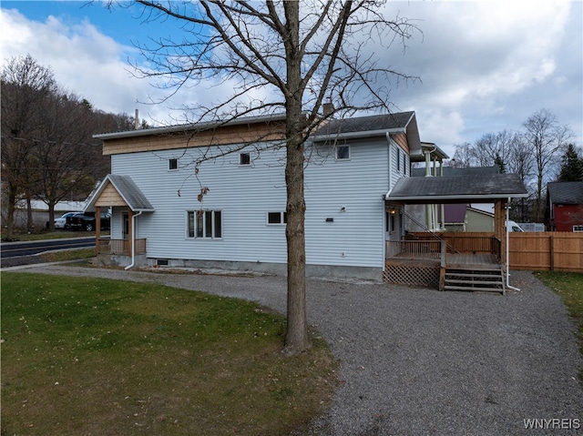 view of side of property with a lawn