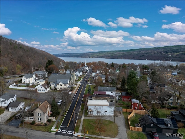 birds eye view of property featuring a water and mountain view