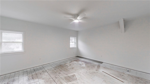 empty room featuring ceiling fan and light hardwood / wood-style flooring