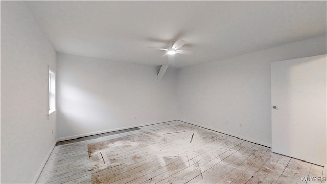 spare room featuring ceiling fan and light wood-type flooring