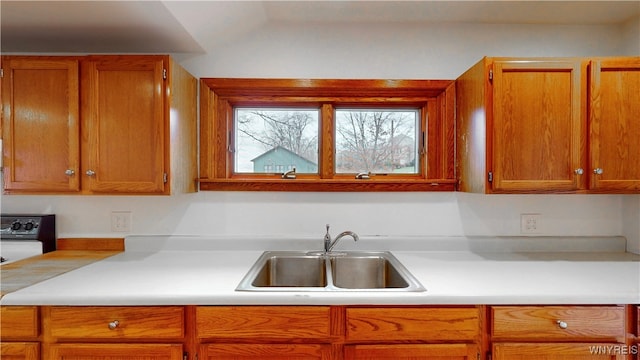 kitchen with sink and vaulted ceiling