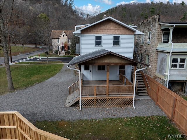 back of house with covered porch