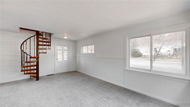 interior space with stairs and carpet flooring