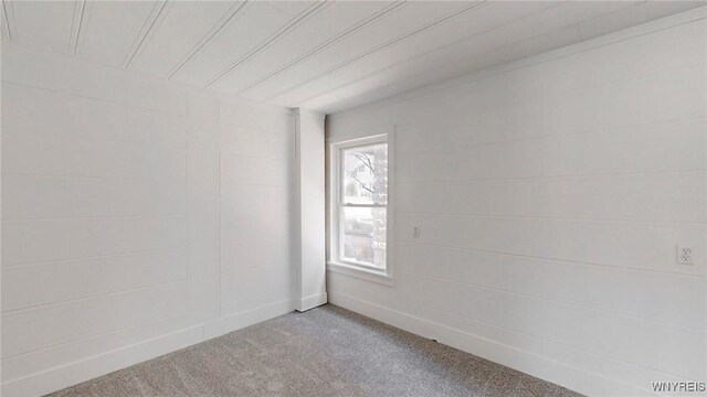 unfurnished room with light colored carpet