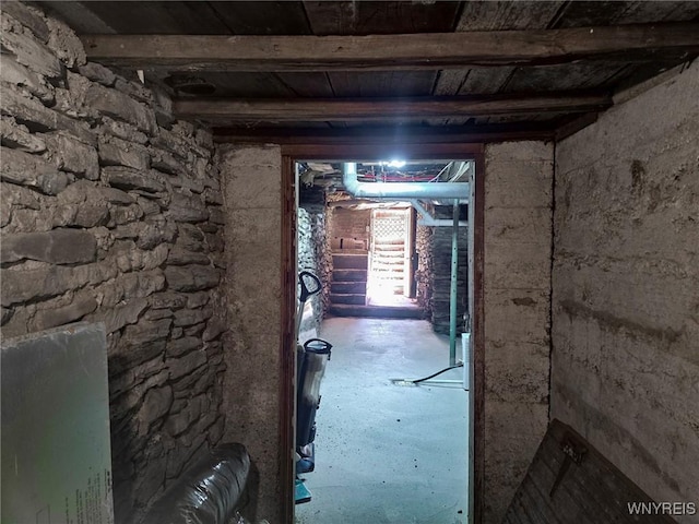 hallway with beamed ceiling and wood ceiling