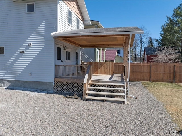 exterior space with a deck and fence