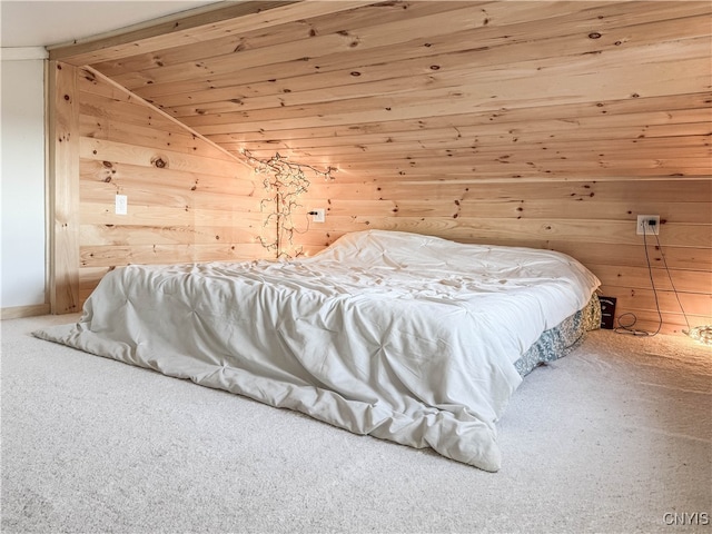 carpeted bedroom featuring wooden walls, wooden ceiling, and lofted ceiling