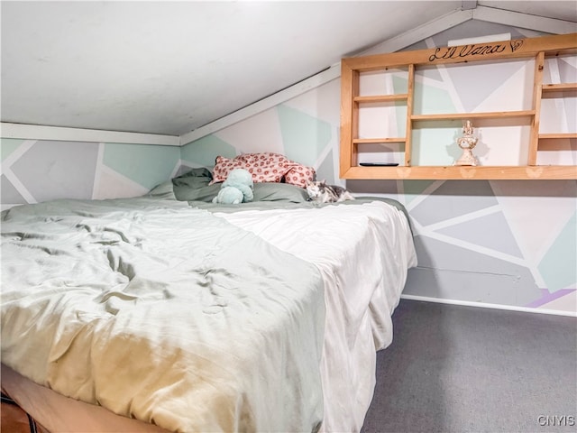 bedroom with carpet floors and vaulted ceiling