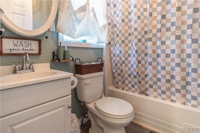 full bathroom featuring vanity, shower / tub combo, and toilet