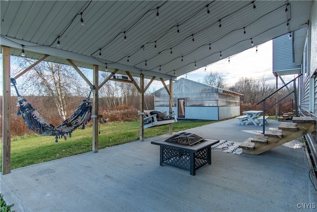 view of patio with an outdoor fire pit