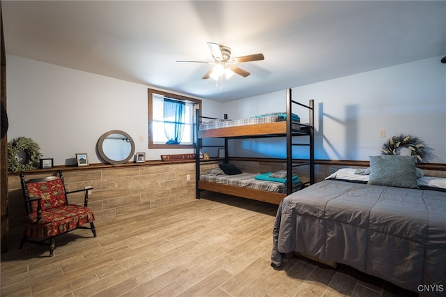 bedroom featuring light hardwood / wood-style floors and ceiling fan