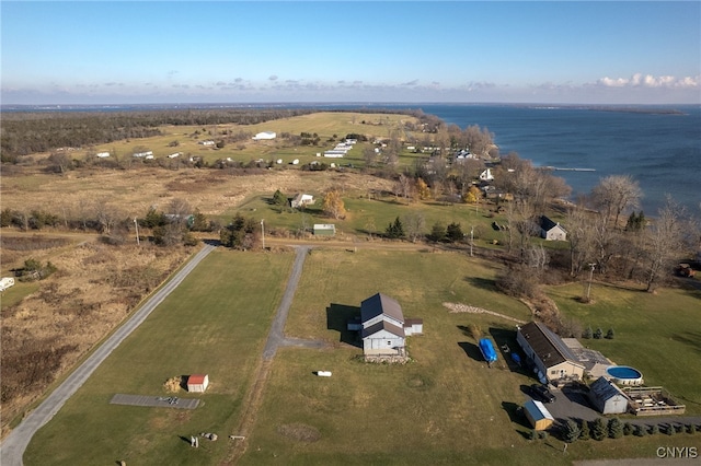 birds eye view of property with a water view and a rural view