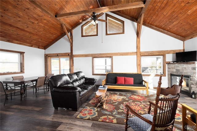 living room with a fireplace, dark hardwood / wood-style flooring, high vaulted ceiling, and a wealth of natural light