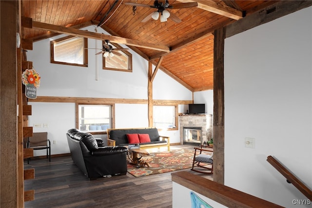 living room featuring vaulted ceiling with beams, wooden ceiling, a stone fireplace, and dark wood-type flooring