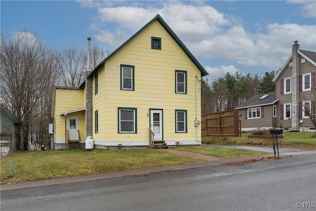 front facade with a front lawn