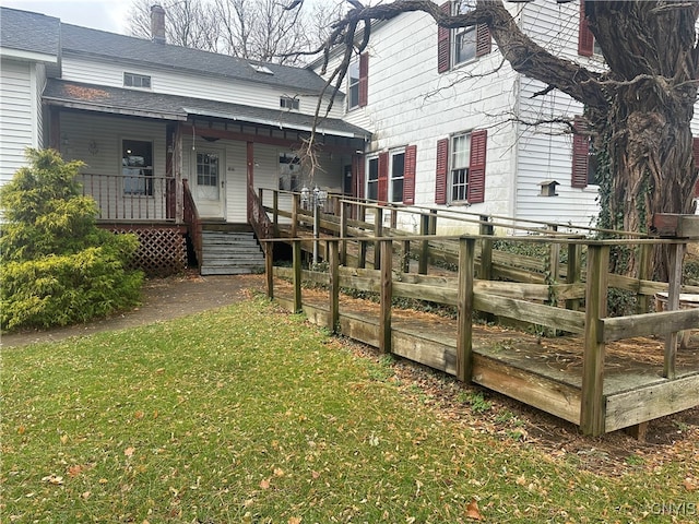 back of house with a yard