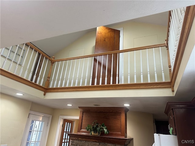 stairs featuring high vaulted ceiling