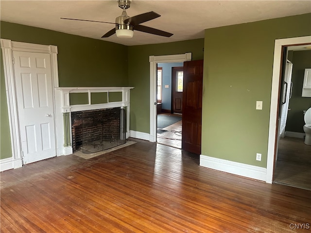 unfurnished living room featuring ceiling fan and wood-type flooring