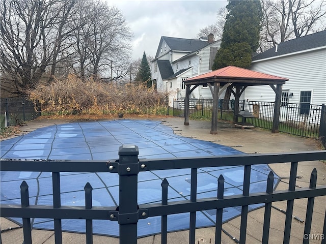 view of swimming pool with a gazebo and a patio