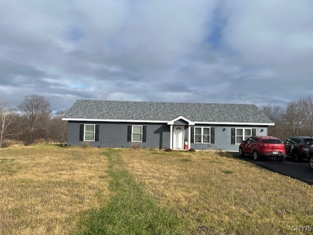 ranch-style house with a front yard