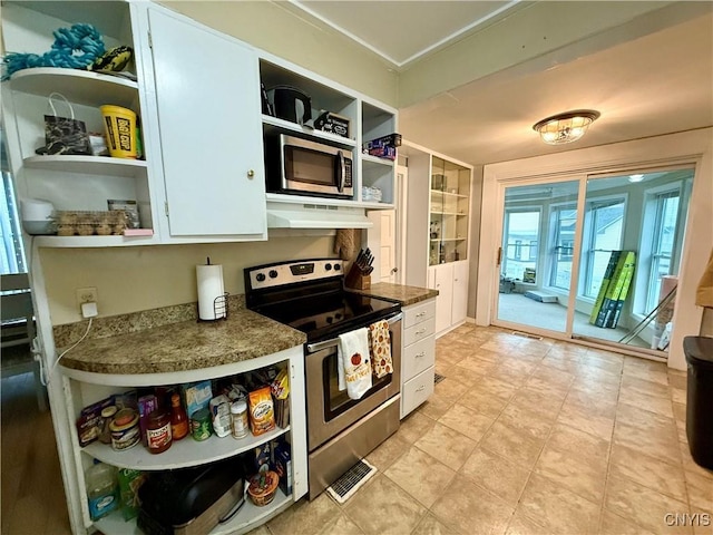 kitchen featuring white cabinetry and appliances with stainless steel finishes