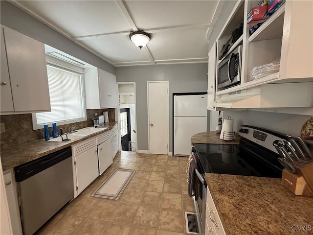 kitchen featuring white cabinetry, appliances with stainless steel finishes, sink, and tasteful backsplash