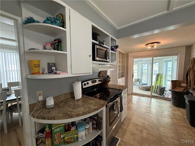 kitchen featuring stainless steel appliances and white cabinets