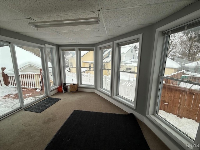 sunroom / solarium featuring a paneled ceiling