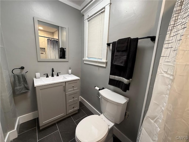 bathroom with vanity, tile patterned flooring, curtained shower, and toilet