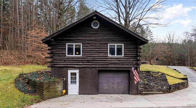 view of side of home featuring a garage