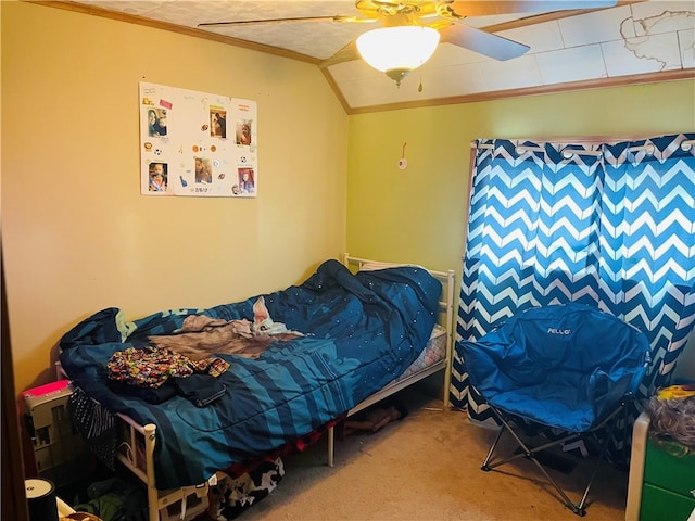 bedroom with carpet flooring, vaulted ceiling, ceiling fan, and crown molding