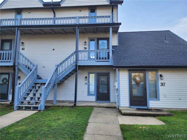 view of front of house featuring a balcony