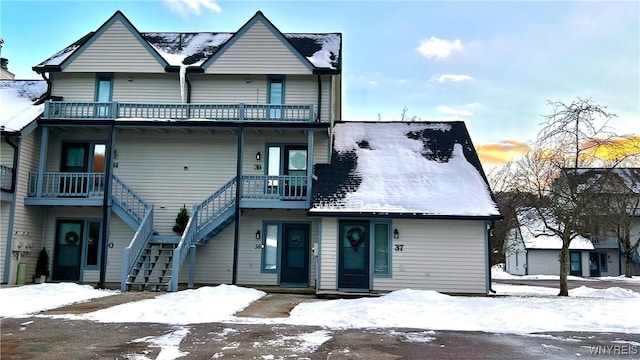 view of front of house featuring a balcony