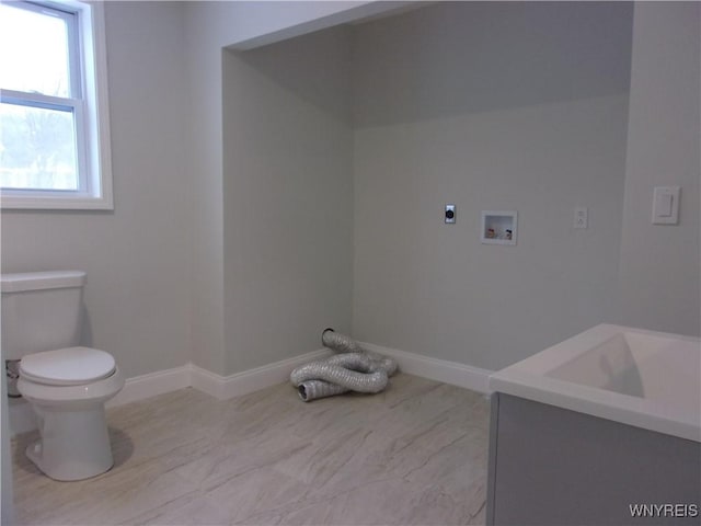 interior space featuring vanity and toilet