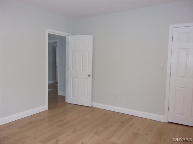 spare room with light hardwood / wood-style floors