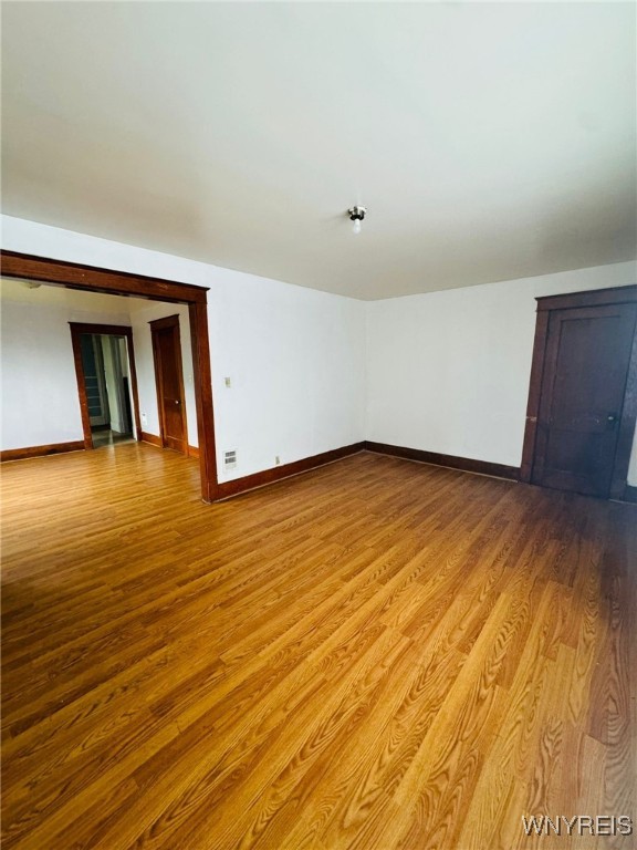 unfurnished room featuring light hardwood / wood-style floors