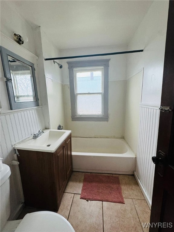 full bathroom featuring tile patterned flooring, vanity, shower / bathtub combination, and toilet