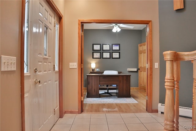 interior space featuring light hardwood / wood-style floors and a baseboard heating unit