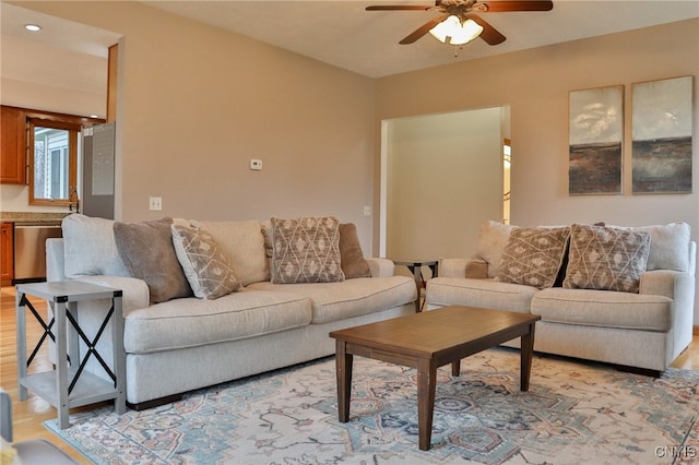 living room with ceiling fan and light hardwood / wood-style floors