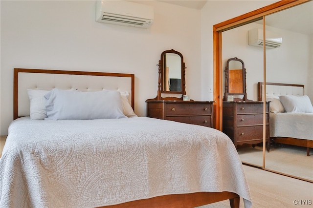 bedroom featuring carpet floors, a closet, and a wall mounted AC