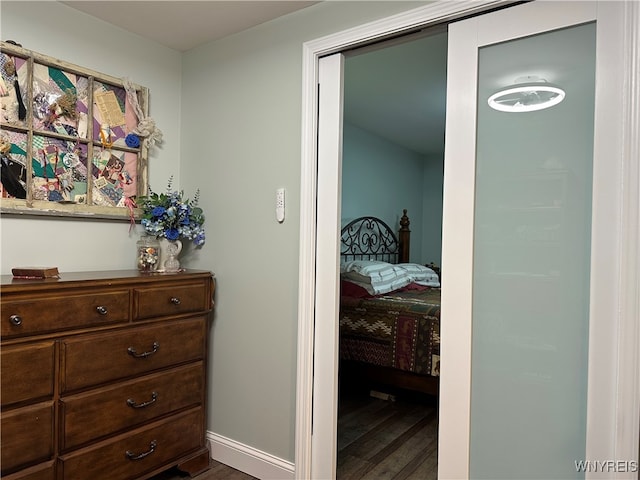 bedroom featuring dark hardwood / wood-style flooring