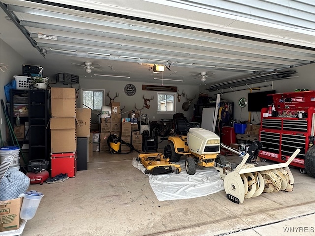 garage featuring a garage door opener and ceiling fan