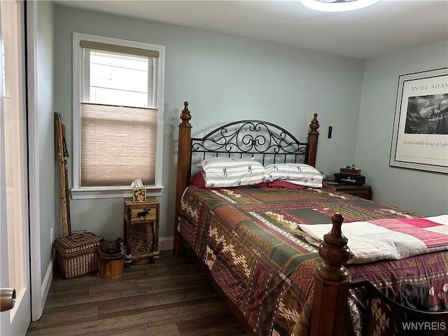 bedroom featuring dark hardwood / wood-style floors