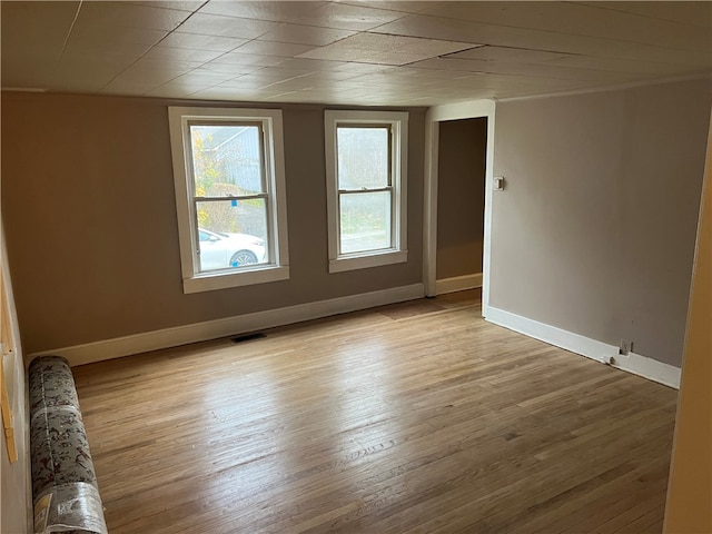 spare room with light wood-type flooring