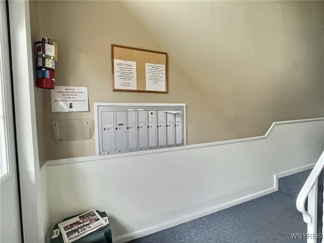 interior space with carpet flooring and mail boxes