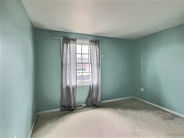 empty room with carpet flooring