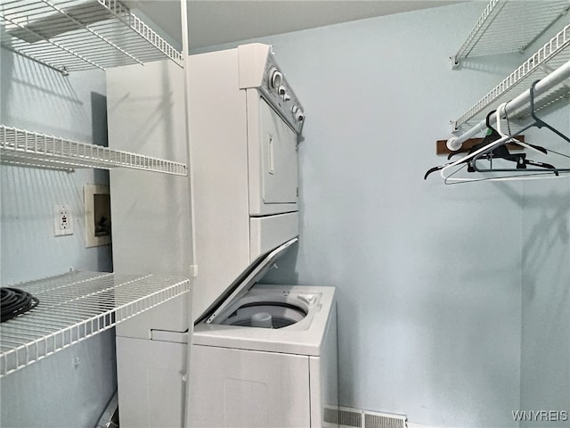 laundry room featuring stacked washing maching and dryer